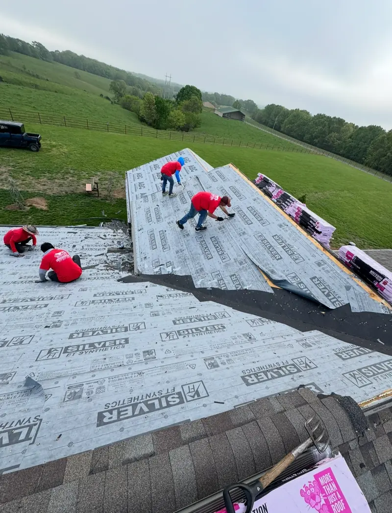 White’s Construction roofing crew installing roof underlayment